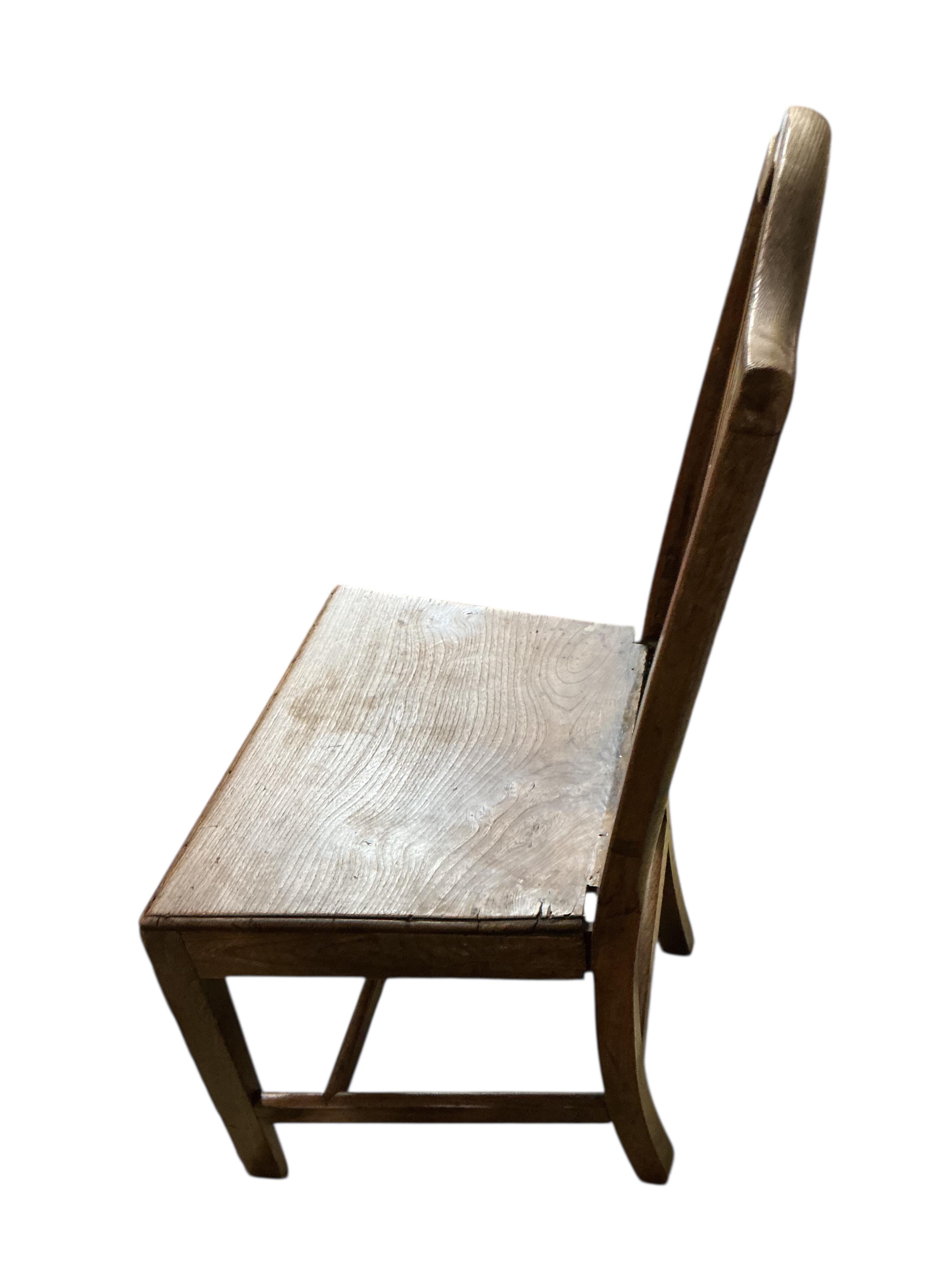 A set of three George III Provincial elm dining chairs, width 49cm, height 99cm